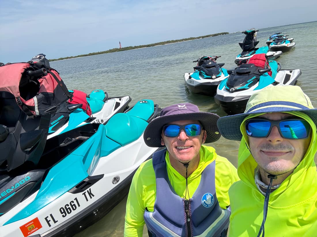 Dave, owner of Clearwater Beach Jet Ski Tours, with his son and tour guide Joe beside their Sea-Doo GTX Pro fleet